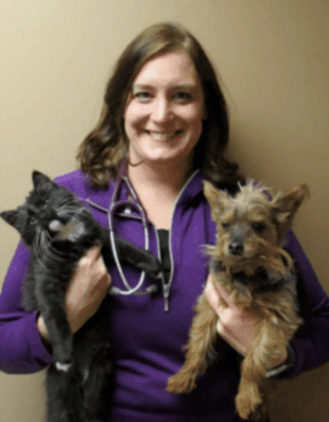 Dr. Jaleen Brunner-Flitz holding a cat and a dog Dr. Jaleen Brunner-Flitz holding a cat and a dog