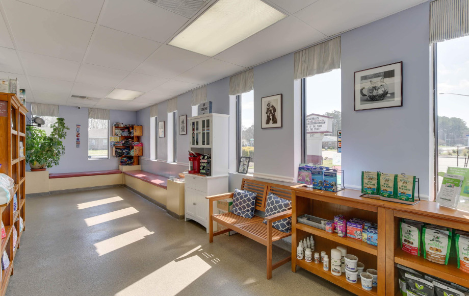 Owl Creek Veterinary Hospital's waiting area where there's plenty of seat to sit in and there are pet products to look at and purchase.