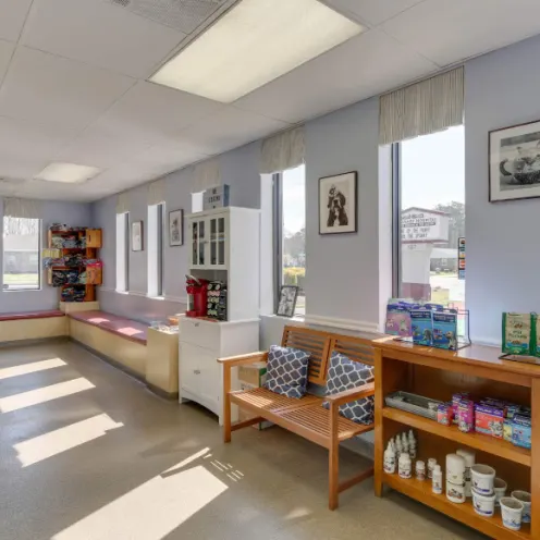 Owl Creek Veterinary Hospital's waiting area where there's plenty of seat to sit in and there are pet products to look at and purchase.