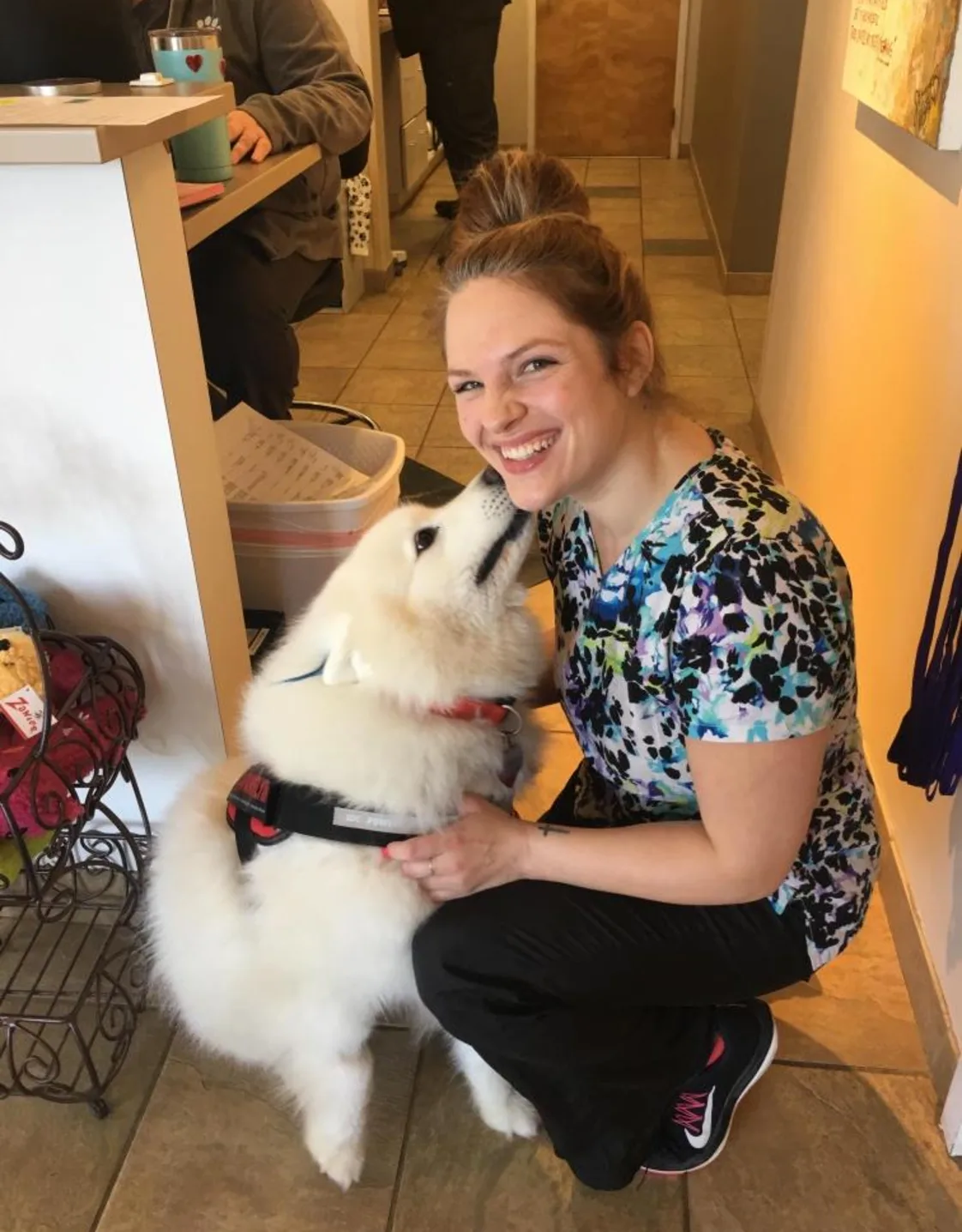 Harmony smiling next to a white dog Harmony smiling next to a white dog