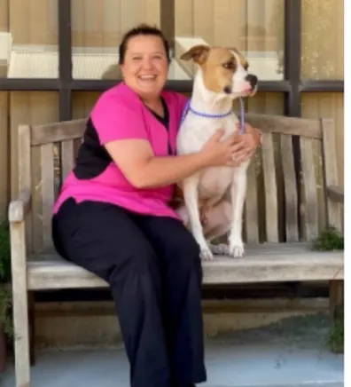 Kristin Goodrow, holding a dog Kristin Goodrow, holding a dog