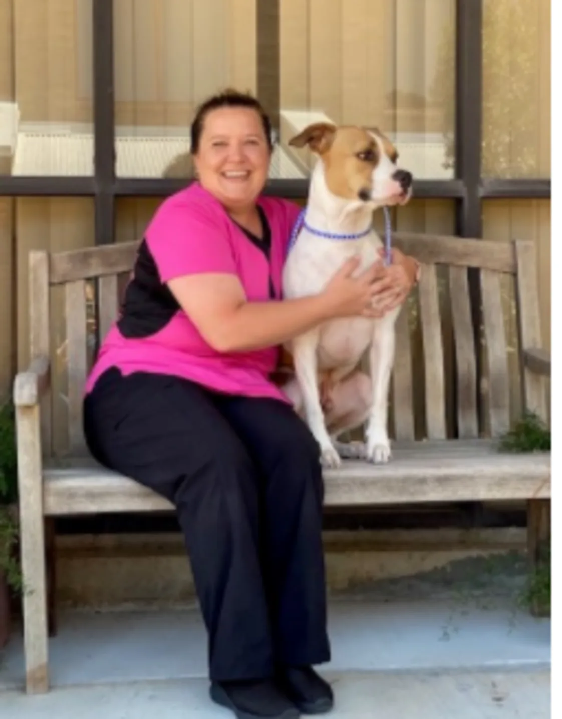 Kristin Goodrow, holding a dog Kristin Goodrow, holding a dog