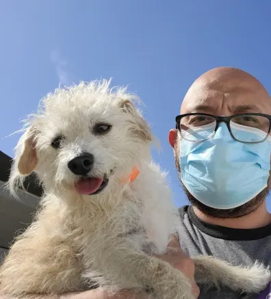 Jason Neal holding dog