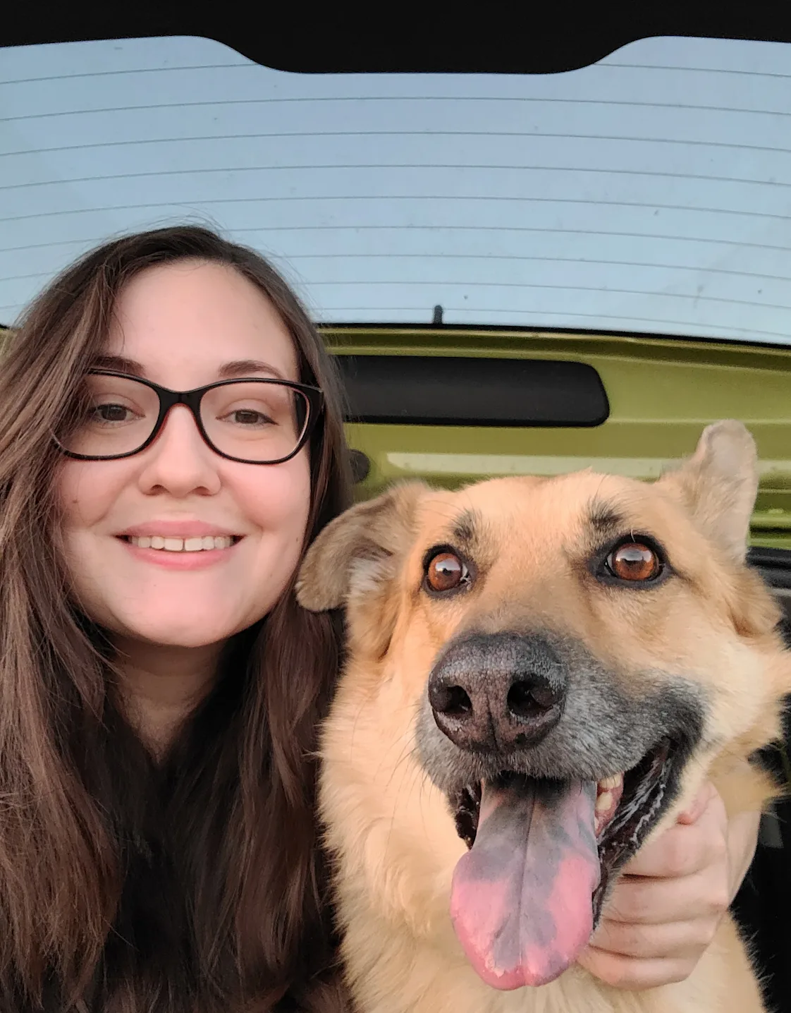 Erin, a Veterinary Assistant at Apollo North Animal Hospital, Holds a Dog Erin, a Veterinary Assistant at Apollo North Animal Hospital, Holds a Dog
