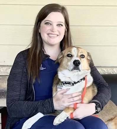 Chelsey Davis with a tan and white dog Chelsey Davis with a tan and white dog