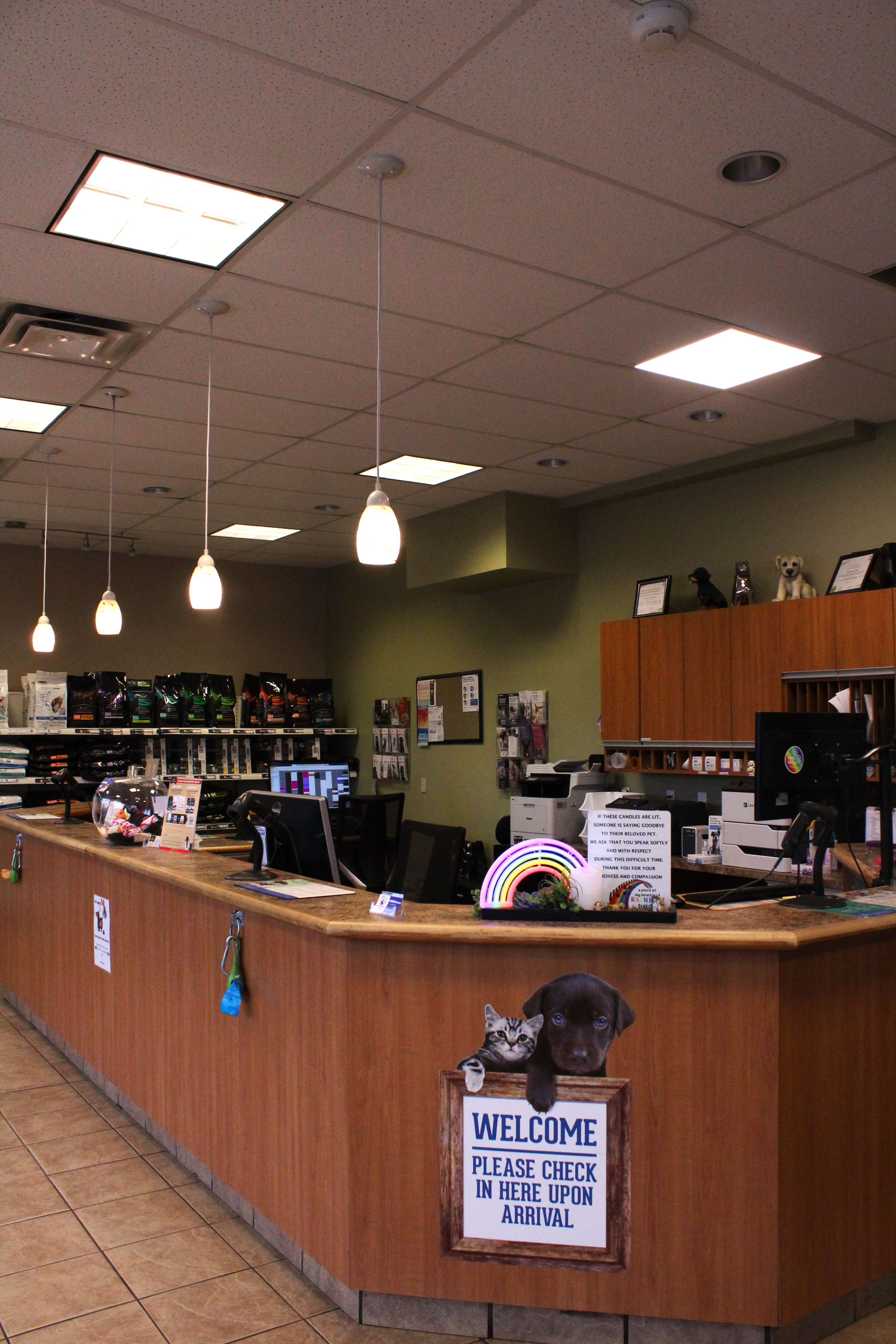 The reception desk with a welcome sign. 