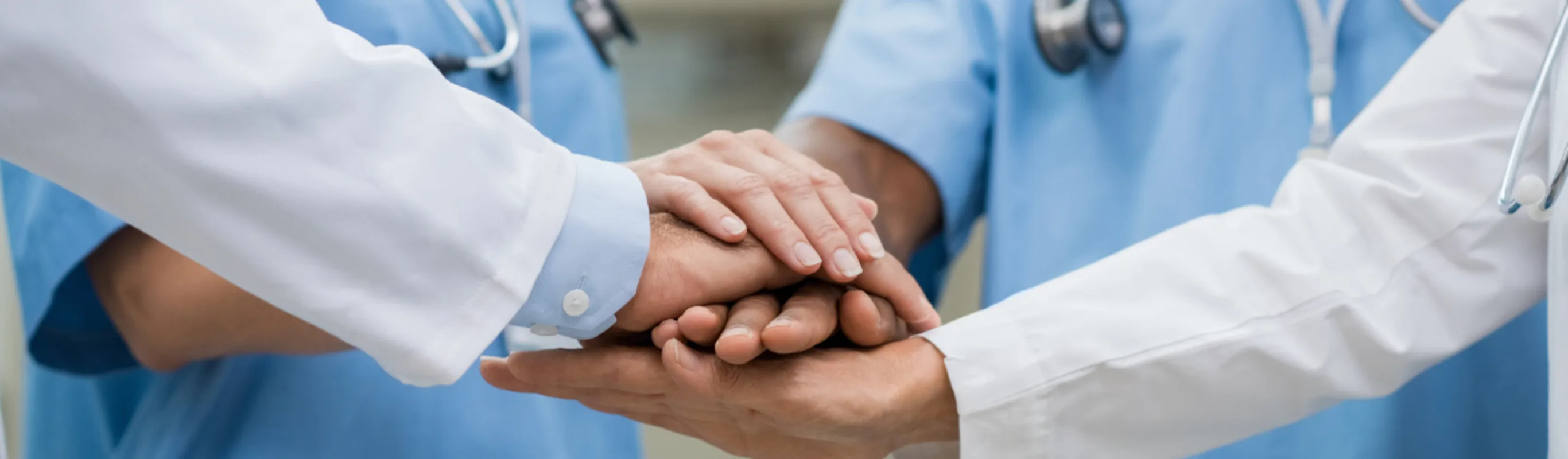 Doctors holding hands. Doctors holding hands.