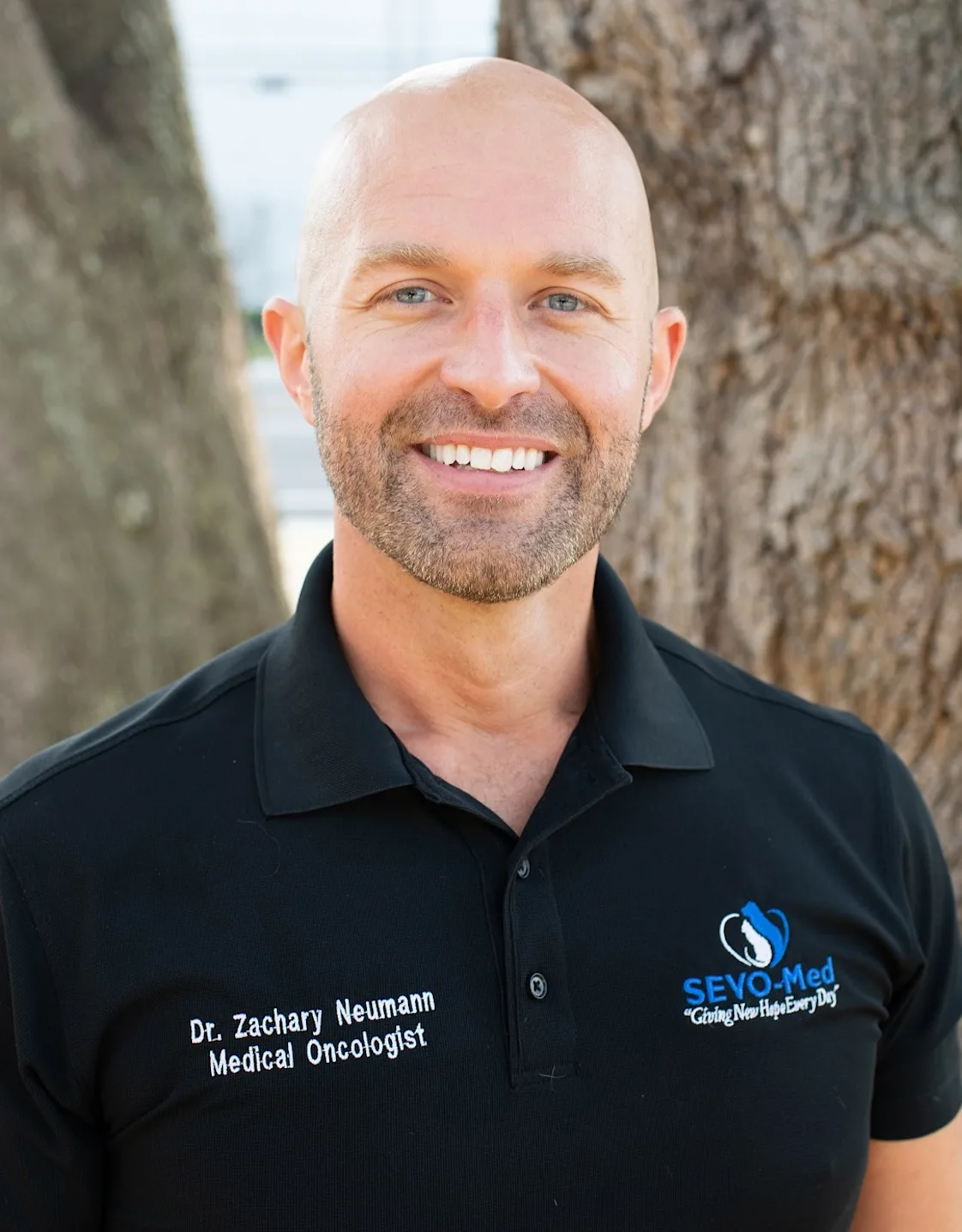 A photo of Zachary Neumann with a Golden Retriever A photo of Zachary Neumann with a Golden Retriever
