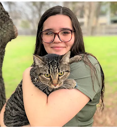 Lauren with a grey tabby cat