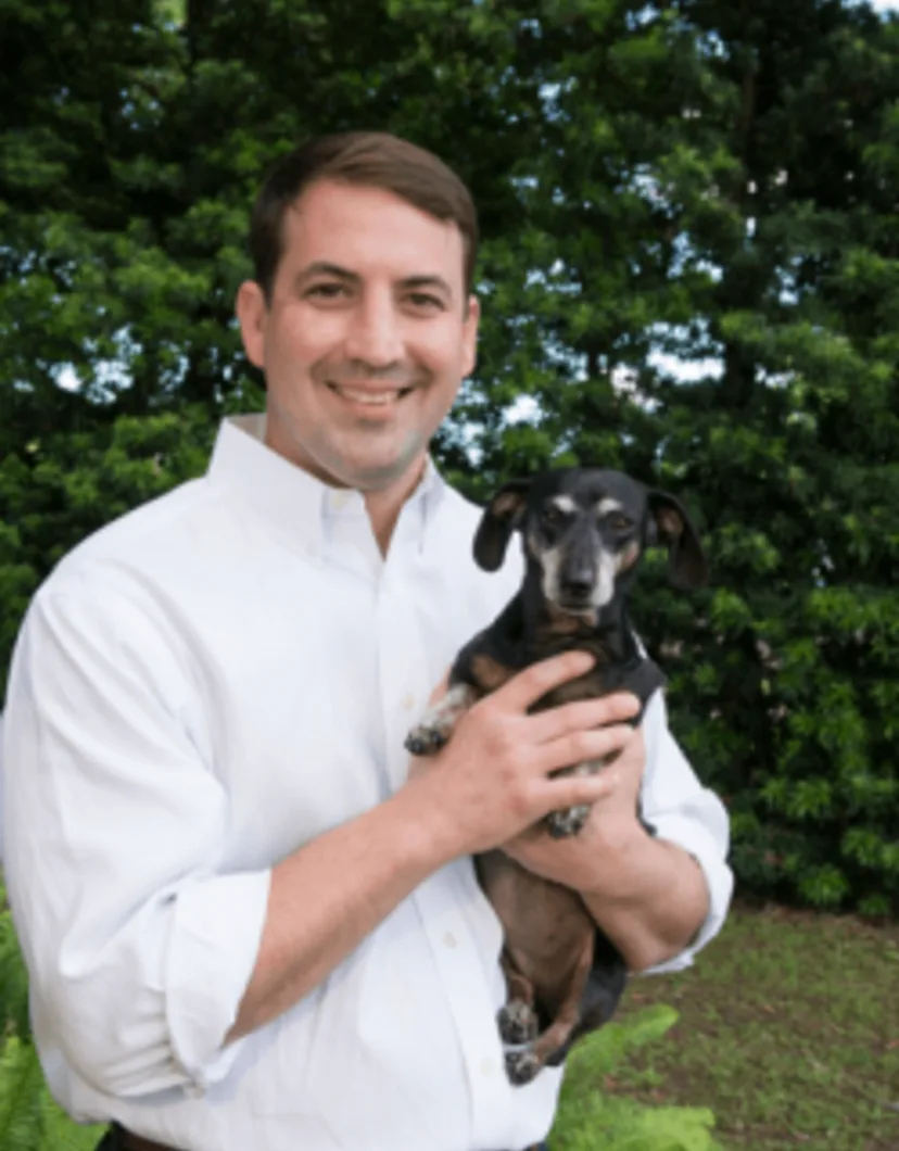 Rene Baumer holding a puppy