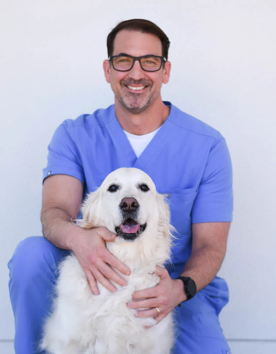 Rene Baumer holding a puppy Rene Baumer holding a puppy