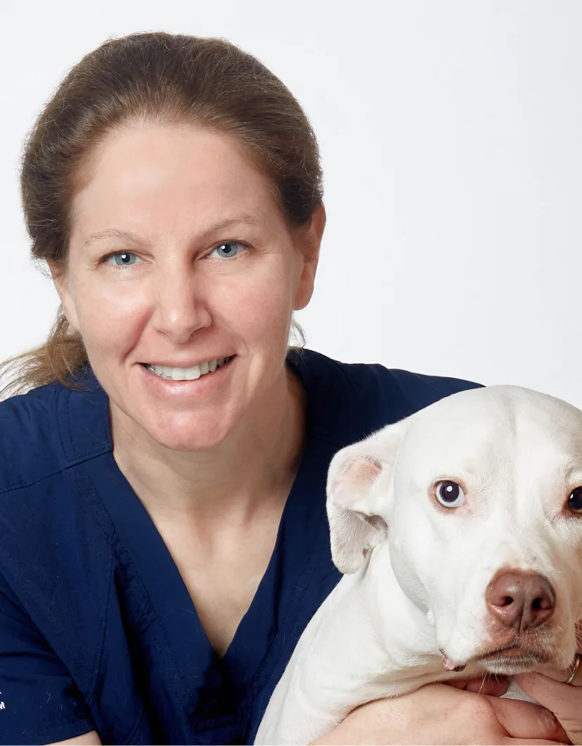 Dr. Sloane Robins holding a dog