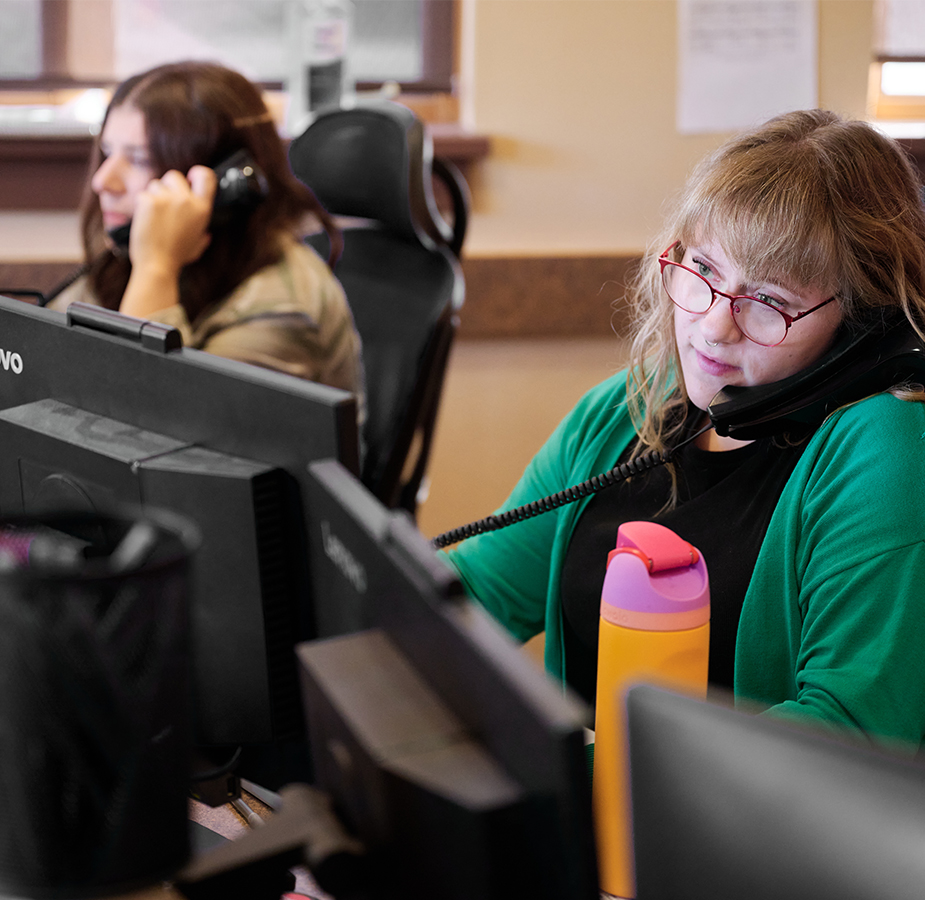 Front desk attendants answering phone calls
