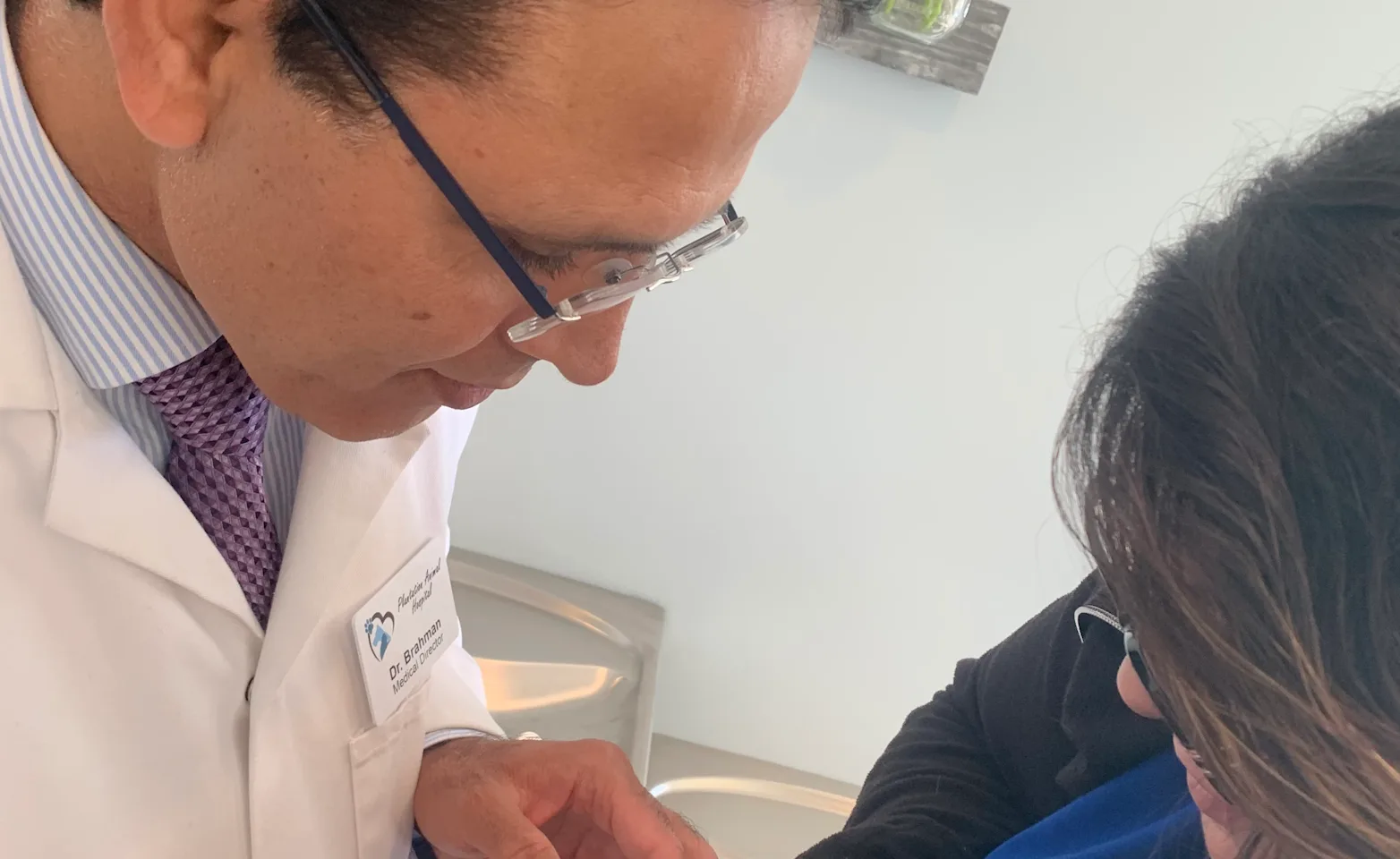 doctor-holding-a-small-pet doctor-holding-a-small-pet