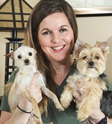 Tiffani Avila holding two small dogs Tiffani Avila holding two small dogs