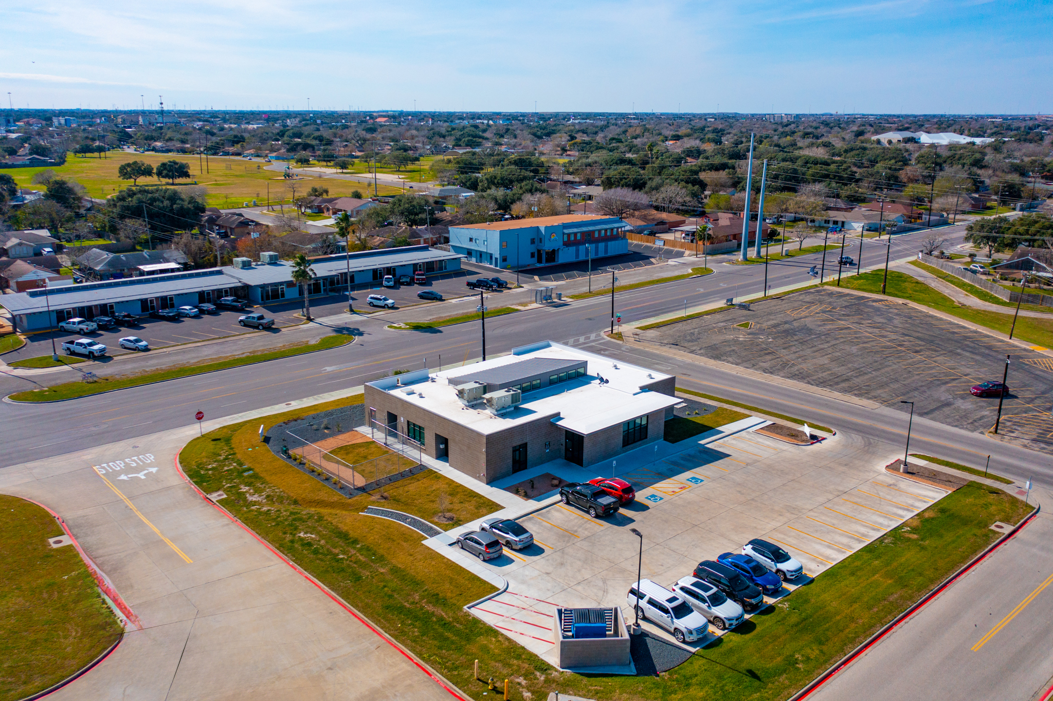 Rear of Building with Parking Lot & Main Entrance