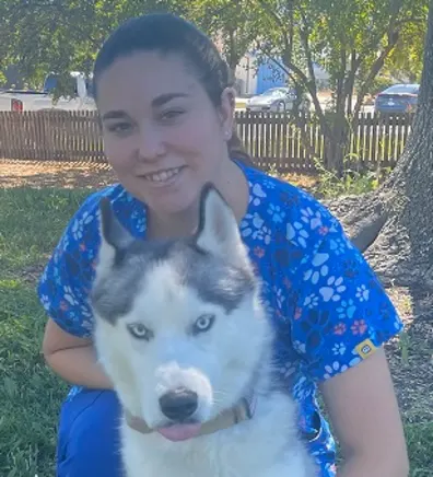 Crystal holding onto a husky. Crystal holding onto a husky.