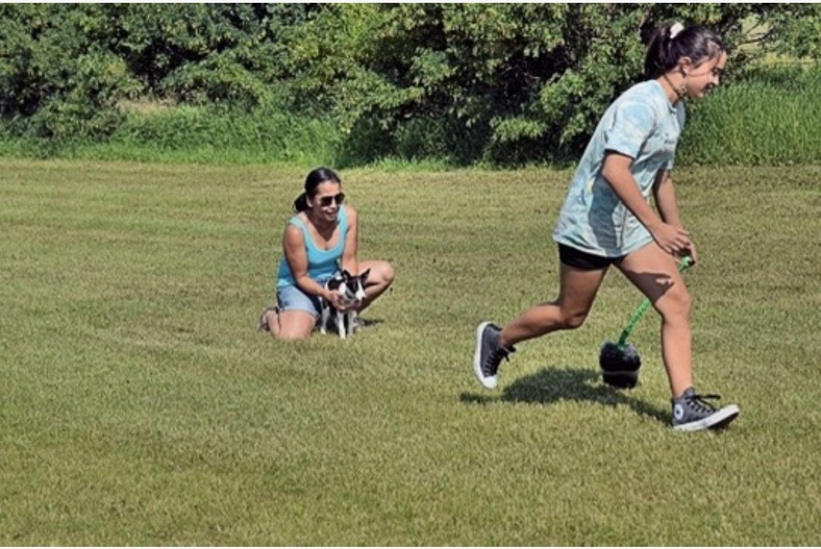 Tam and puppy training outside