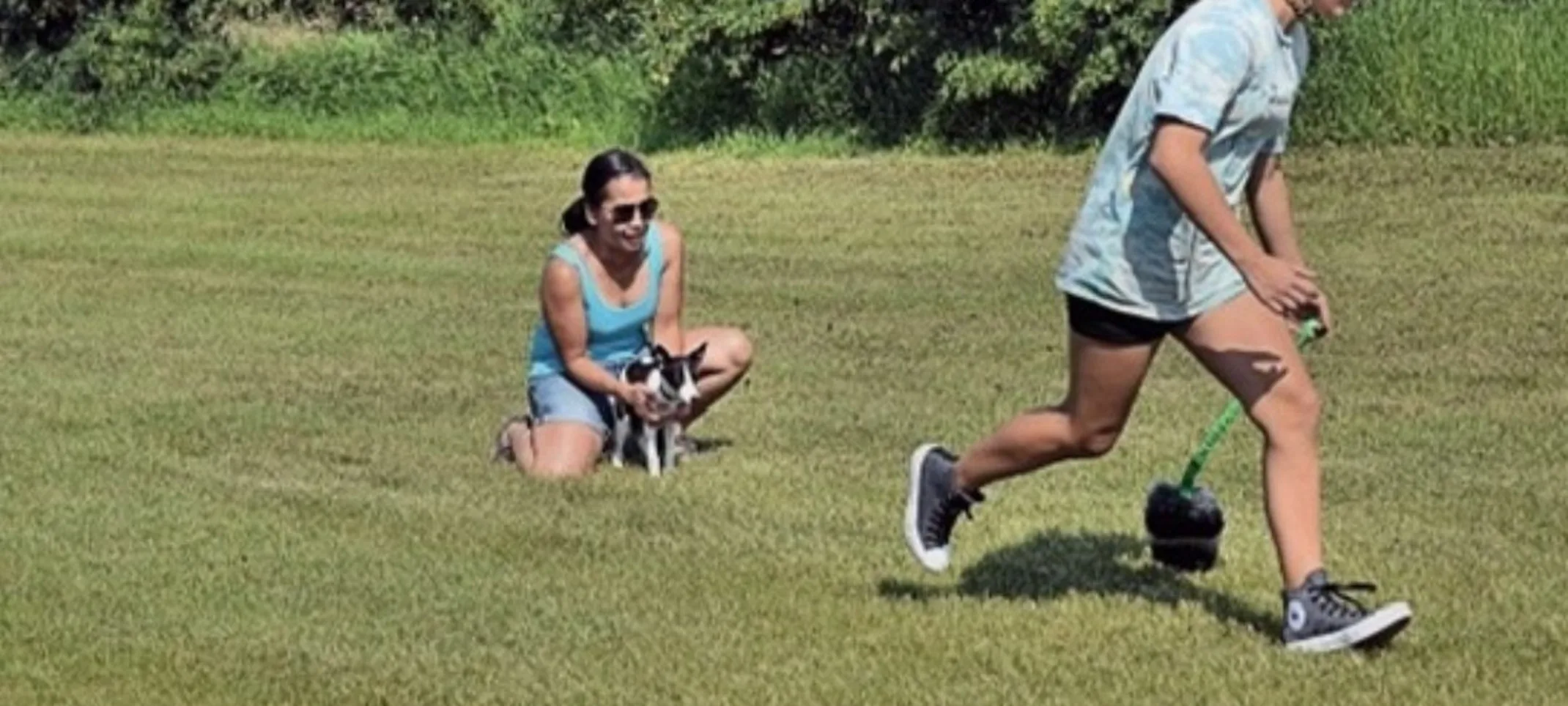 Tam and puppy training outside Tam and puppy training outside