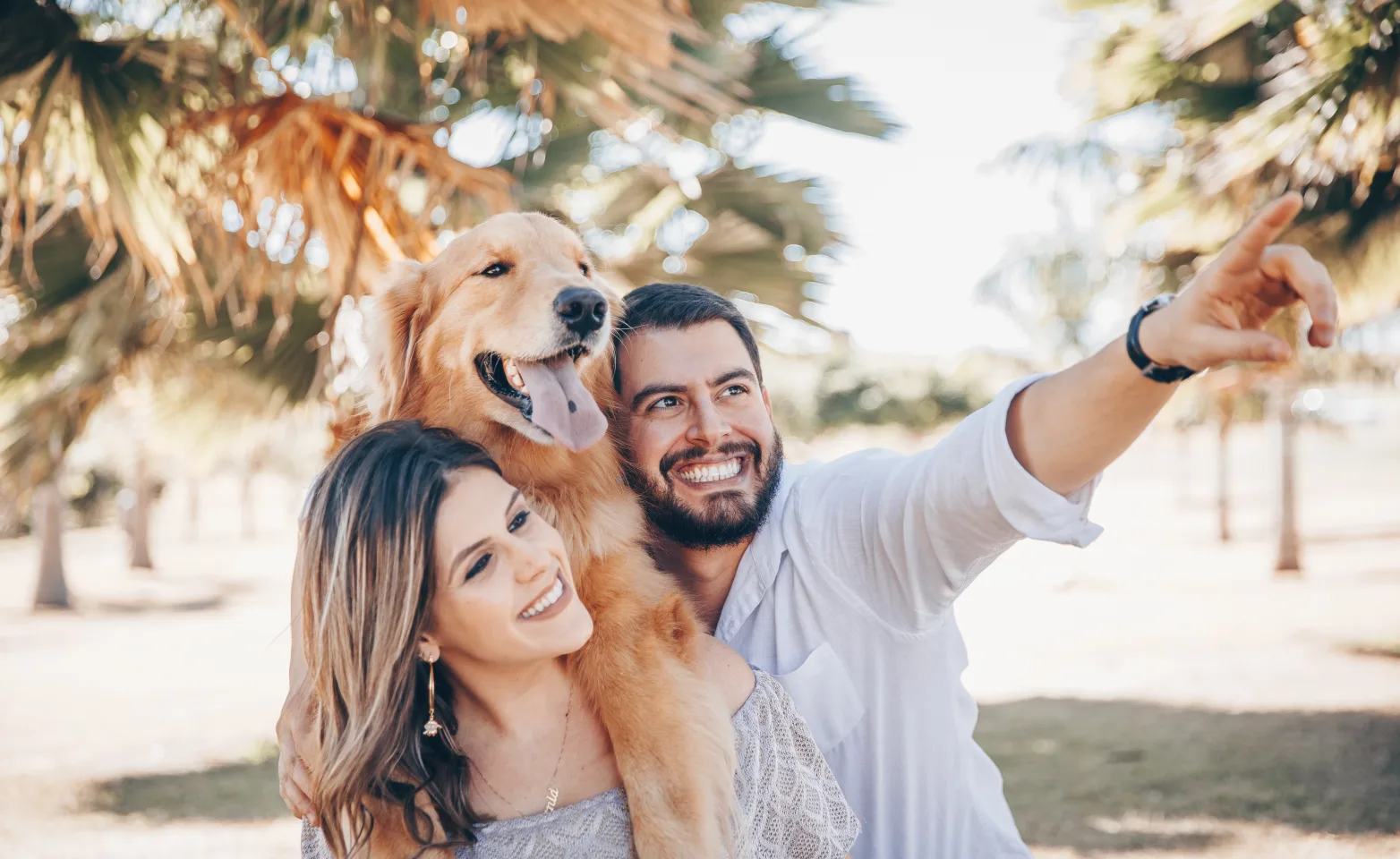 Happy couple with their dog