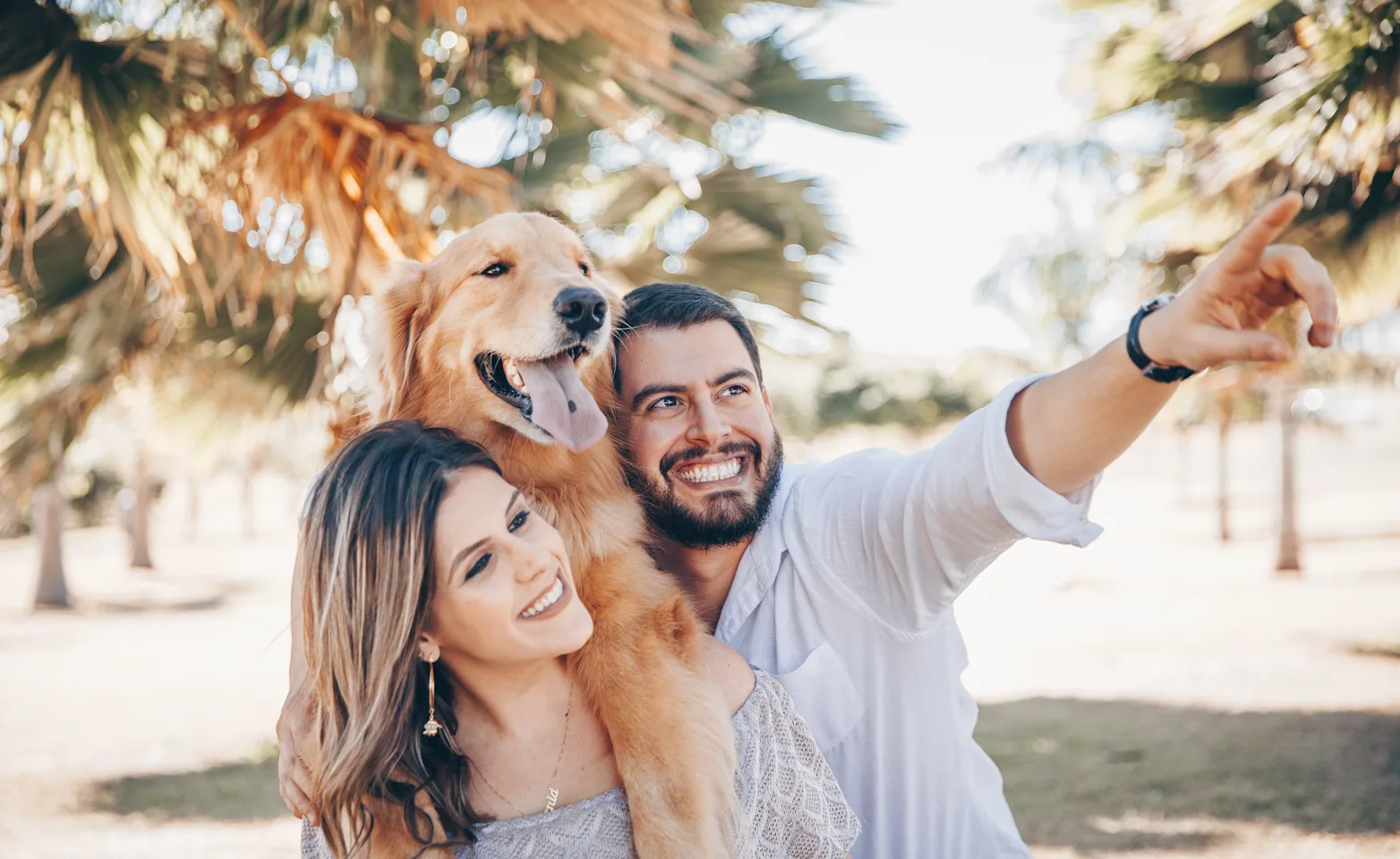 Happy couple with their dog Happy couple with their dog