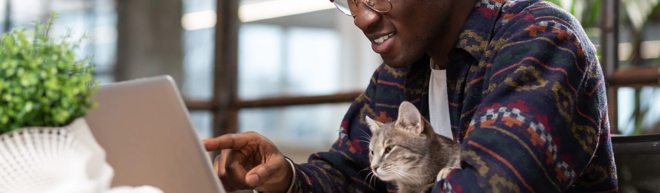 Man with cat and laptop