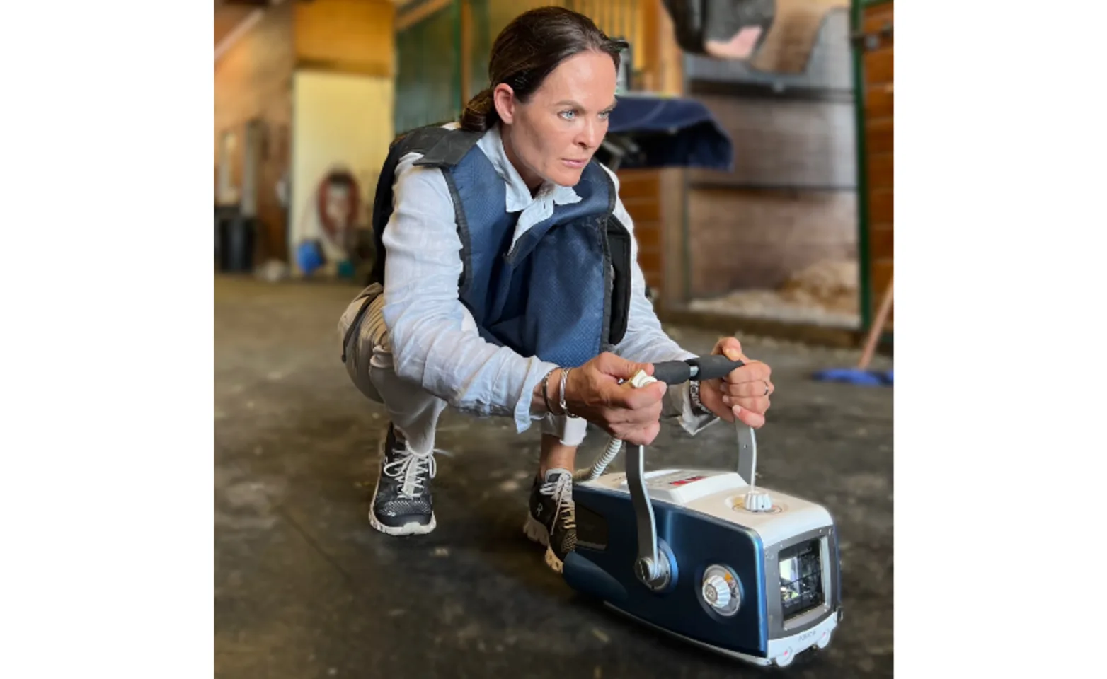 Dr. Tiffany Marr takes radiographs in a barn aisle