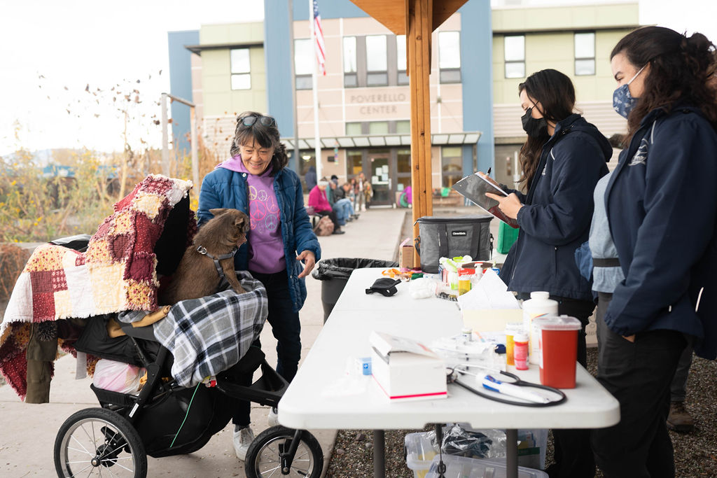 Staff with lady and dog in stroller