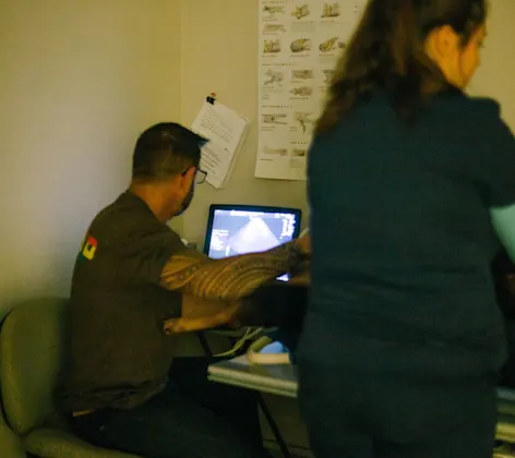 staff looking at an ultrasound staff looking at an ultrasound