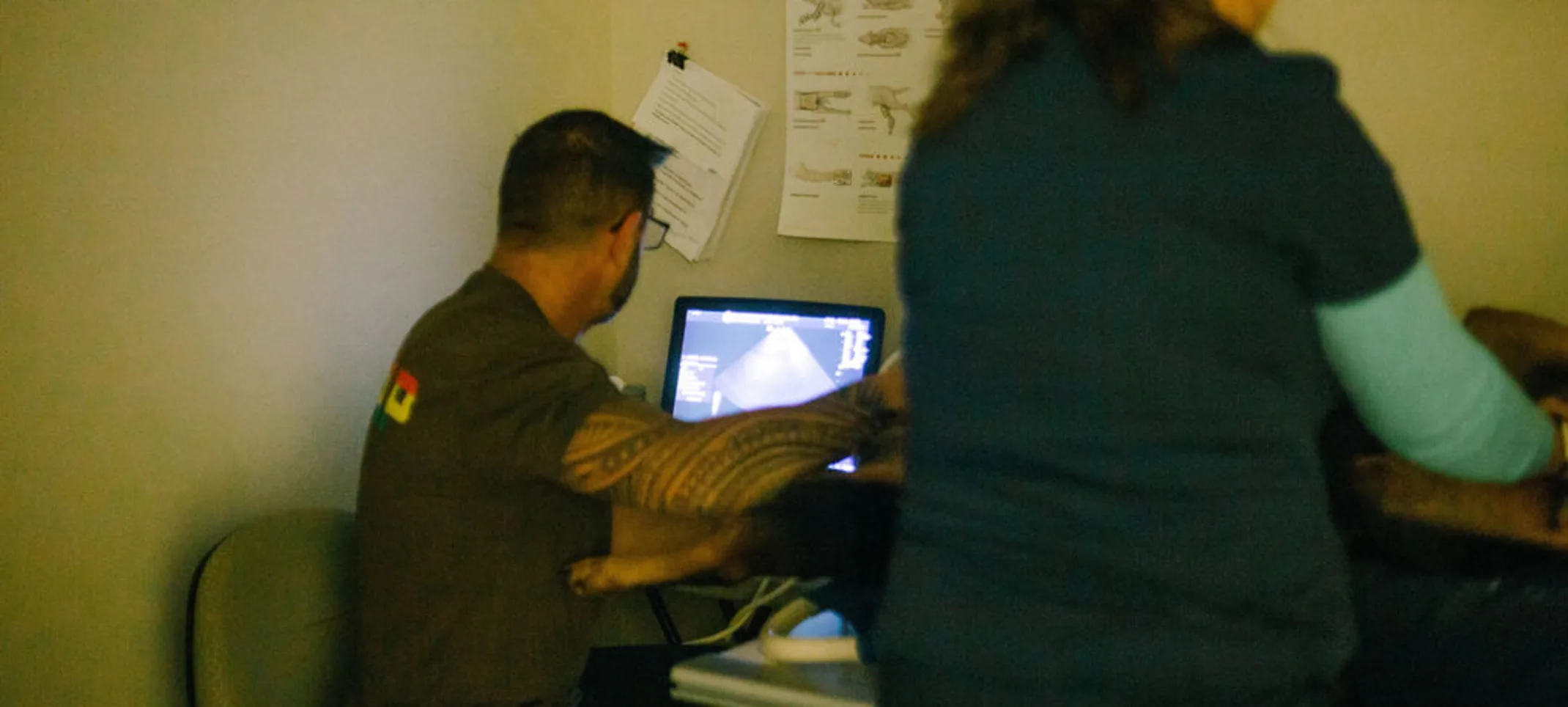 staff looking at an ultrasound