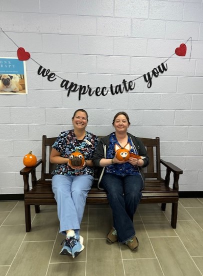  Staff members with pumpkins