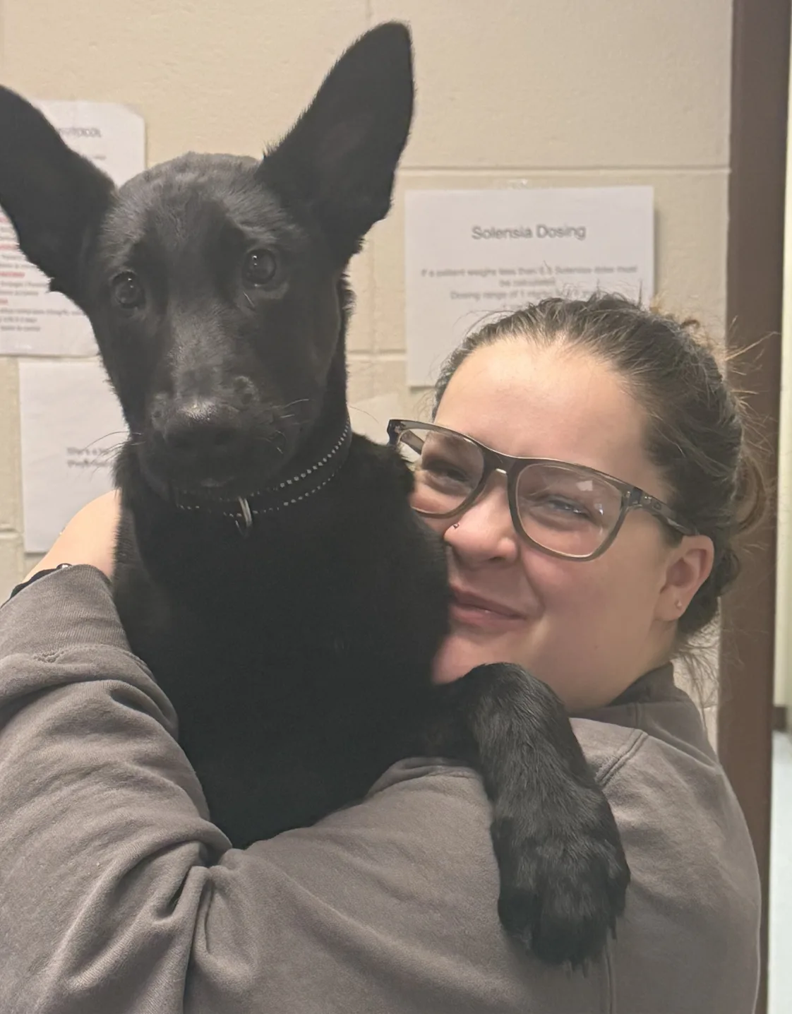 Cheyanne of the Paw Patch Place holding a brown dog Cheyanne of the Paw Patch Place holding a brown dog