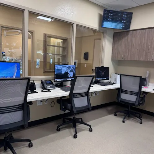 Back office lined with office chairs and monitors. Back office lined with office chairs and monitors.