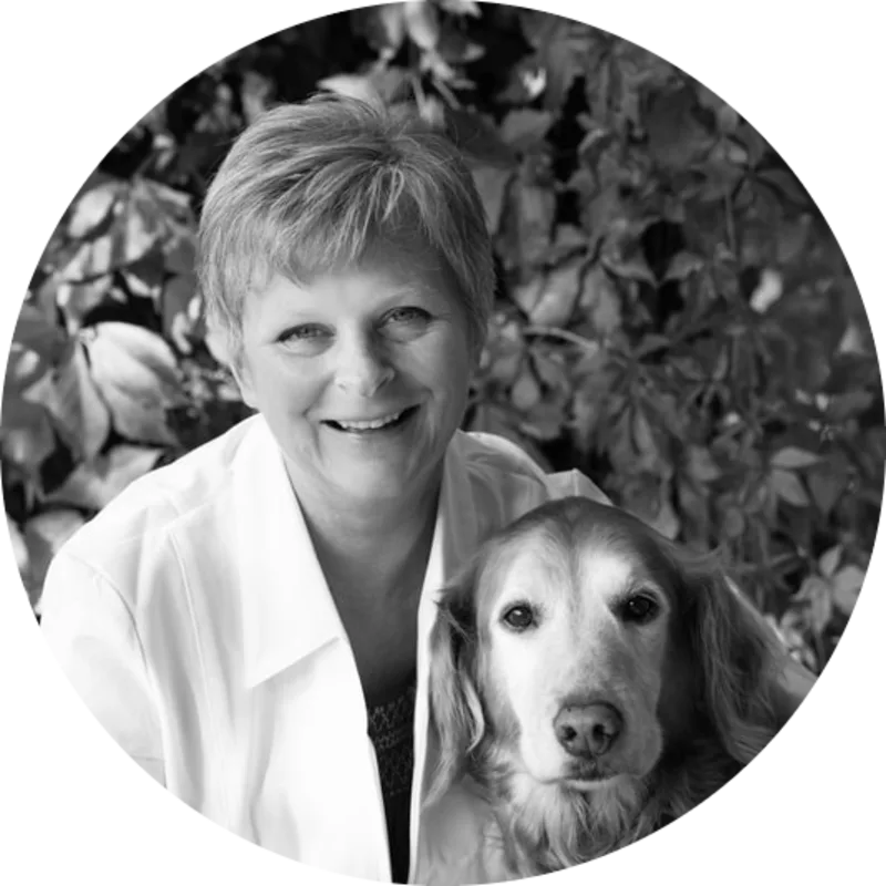 A portrait photo of Dr. Kathy Rasmussen with her golden retriever A portrait photo of Dr. Kathy Rasmussen with her golden retriever