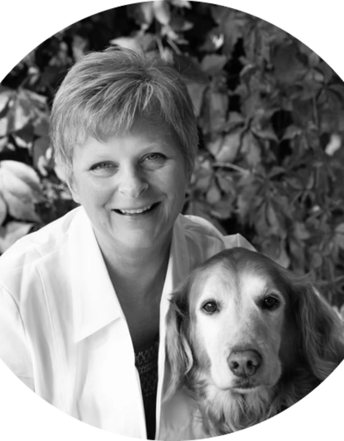 A portrait photo of Dr. Kathy Rasmussen with her golden retriever A portrait photo of Dr. Kathy Rasmussen with her golden retriever