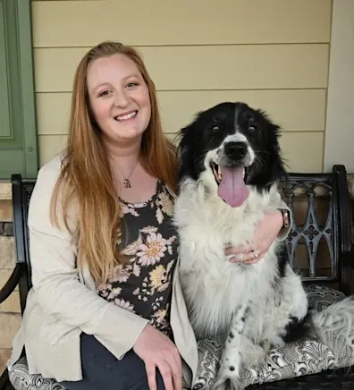 Kate Carrozza with a black and white dog Kate Carrozza with a black and white dog