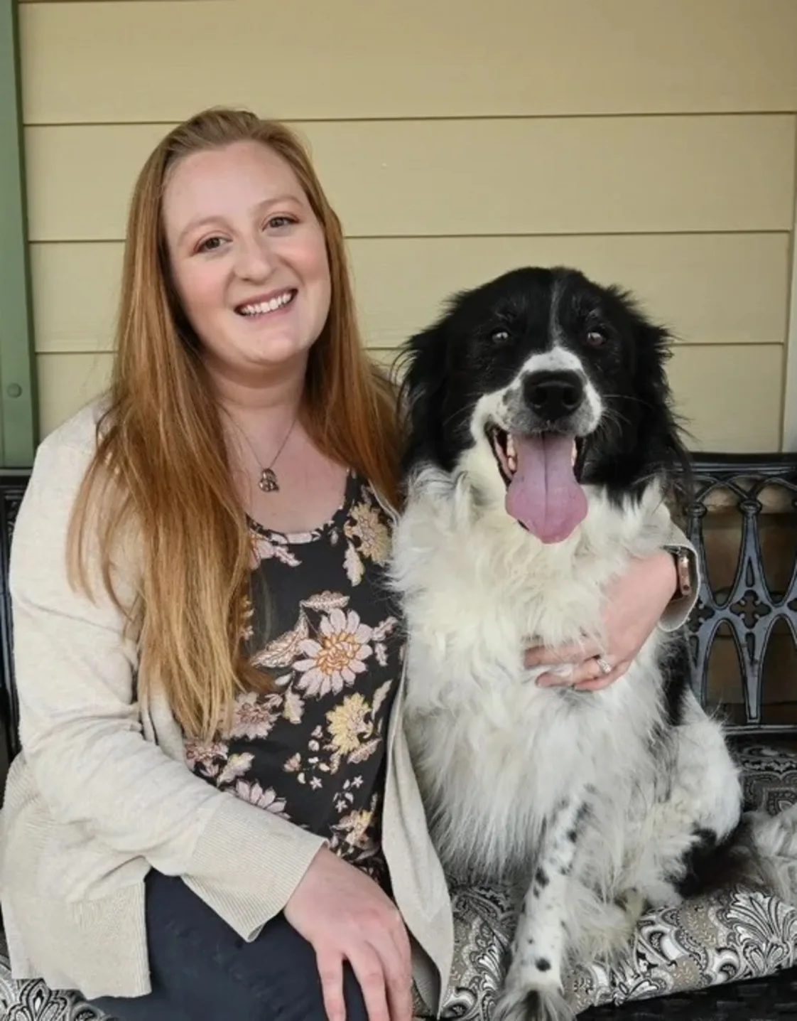 Kate Carrozza with a black and white dog Kate Carrozza with a black and white dog