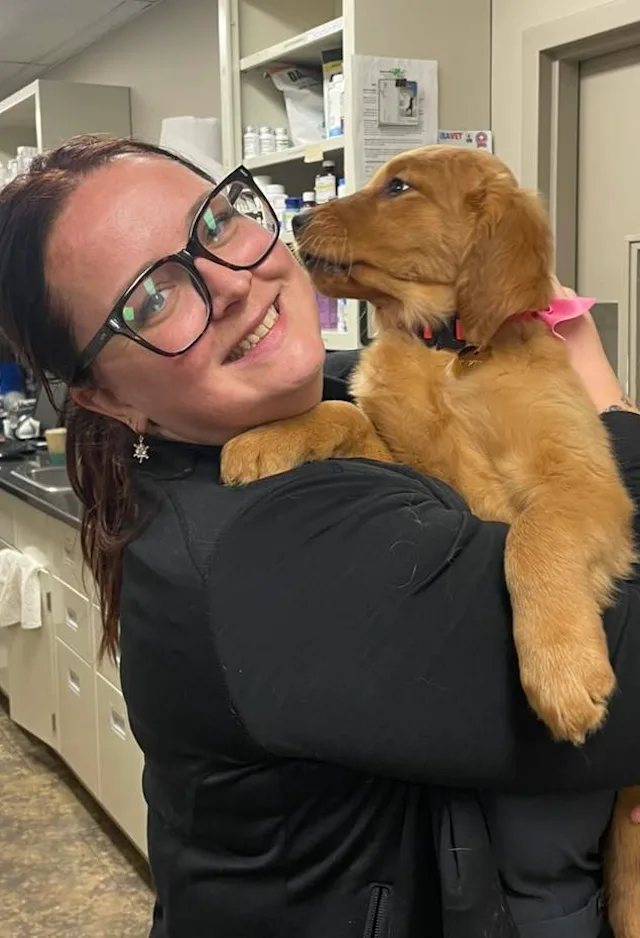 Team Member with Happy Pet Team Member with Happy Pet