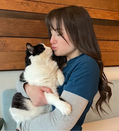 Bree, staff at Rose Valley Veterinary Hospital, holding a cat Bree, staff at Rose Valley Veterinary Hospital, holding a cat