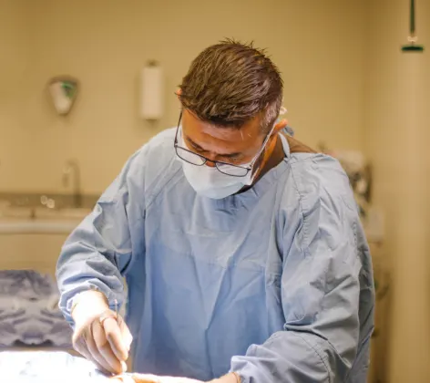 Surgeon performing surgery
