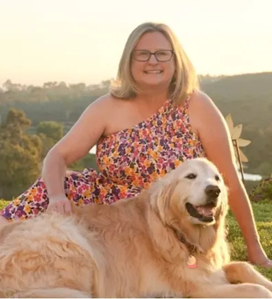 Carrie holding a golden retriever puppy Carrie holding a golden retriever puppy