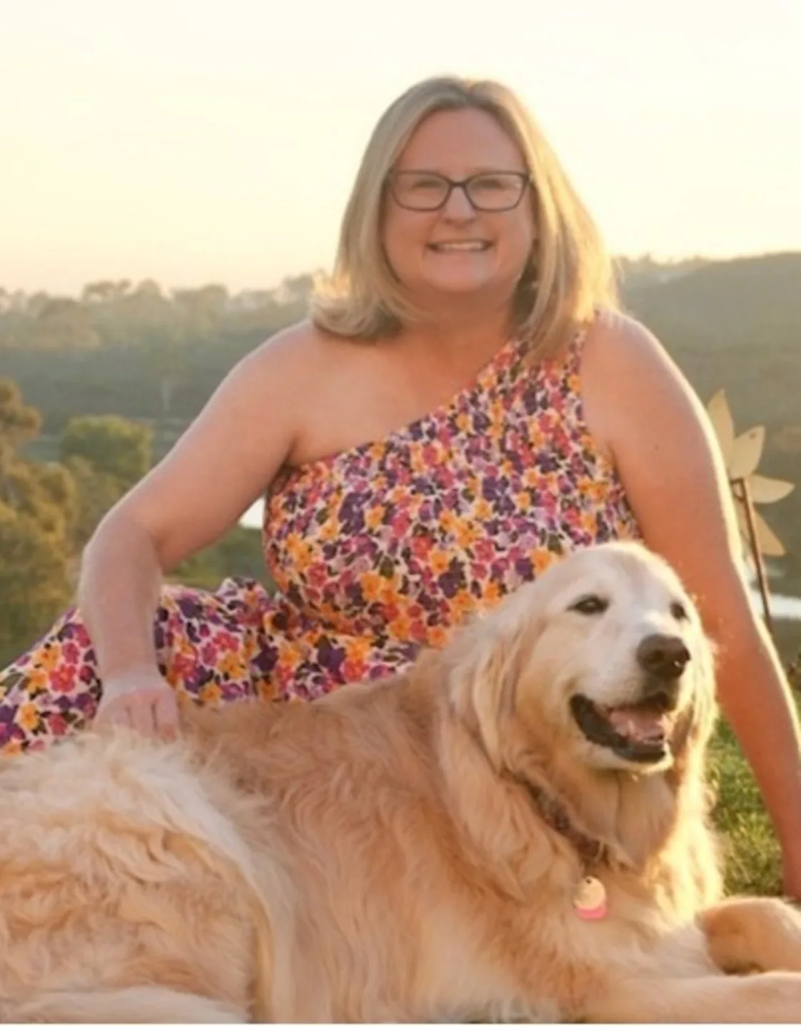 Carrie holding a golden retriever puppy Carrie holding a golden retriever puppy