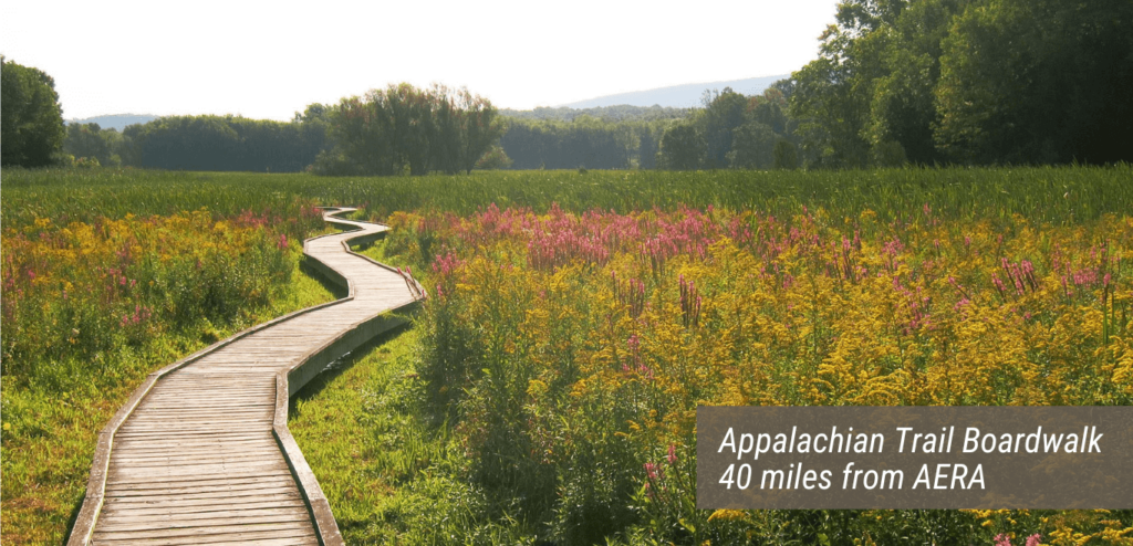 An image of the Appalachian Trail Boardwalk with text stating "Appalachian Trail Boardwalk 40 miles from AERA".