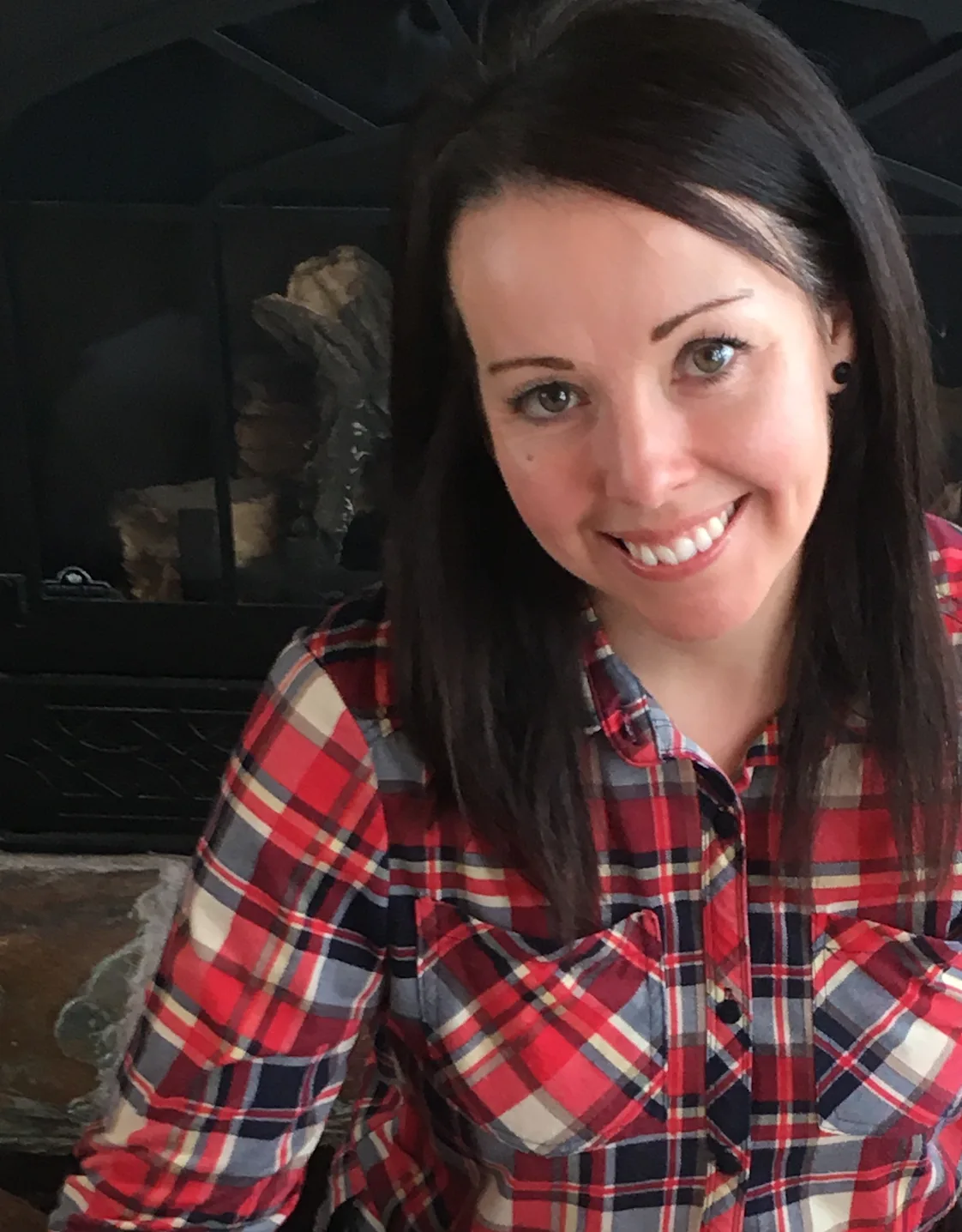Wendy Mock in front of a fireplace Wendy Mock in front of a fireplace