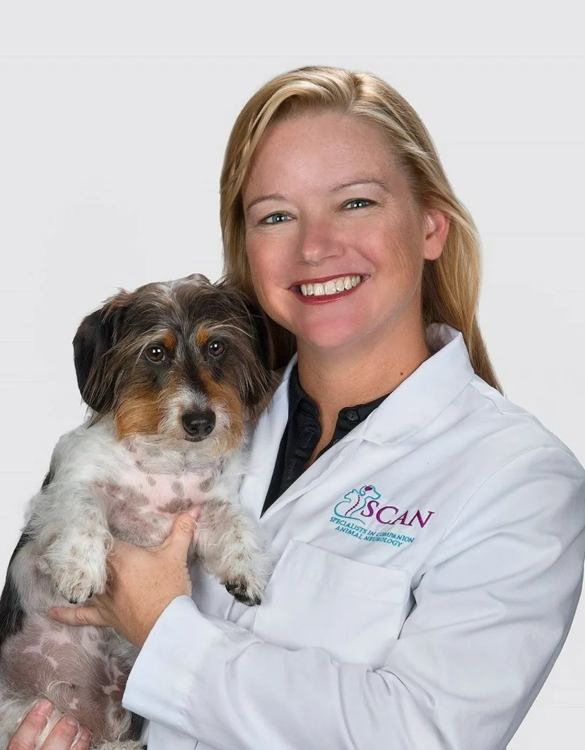 Dr. Carnes holding a scruffy dog
