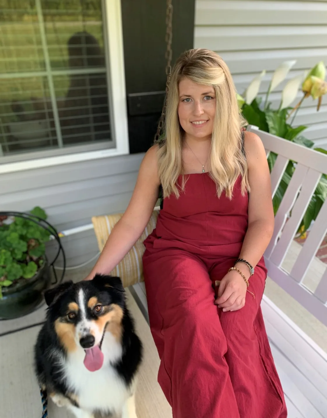 Hayley, groomer at My Second Home, next to dog Hayley, groomer at My Second Home, next to dog