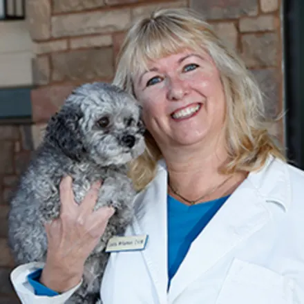 Dr. Laura Williamson holding small dog