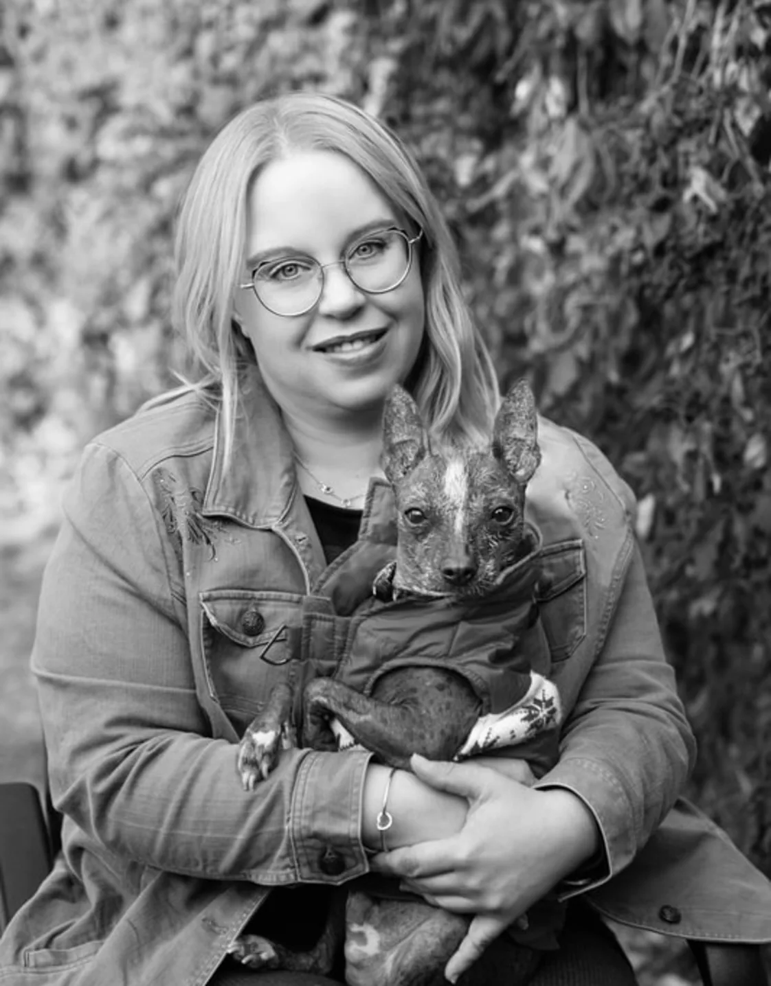 Hospital Manager Crystal posing with her dog Hospital Manager Crystal posing with her dog
