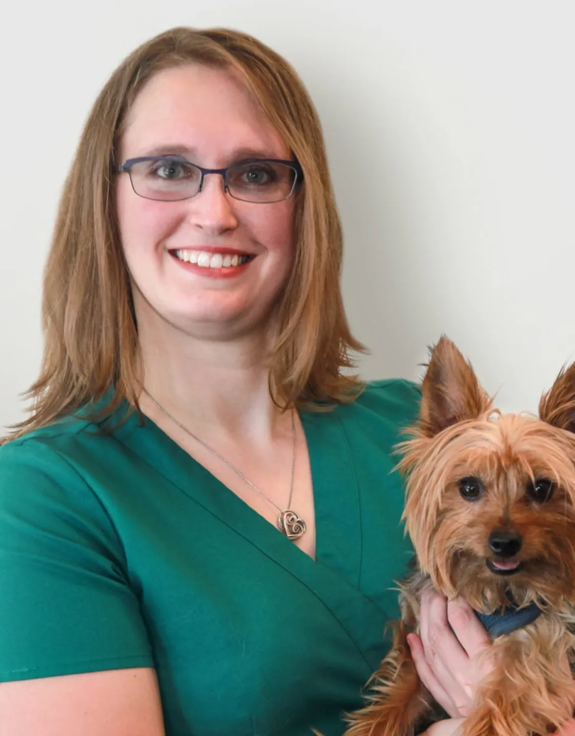 Natasha Pogue holding a yorkie Natasha Pogue holding a yorkie