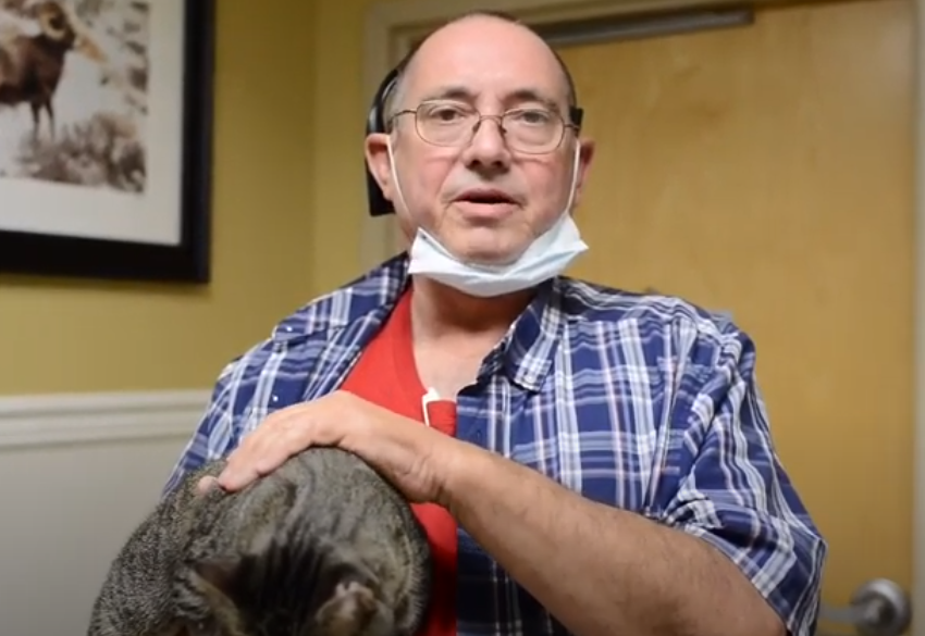 Client with cat at AMC Hattiesburg